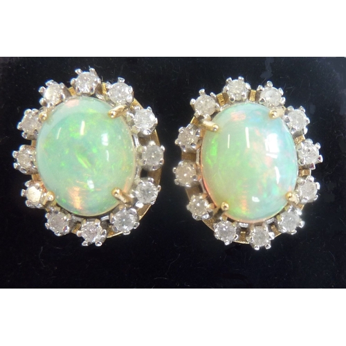 113 - A pair of fine quality 18-carat opal and diamond cluster earrings