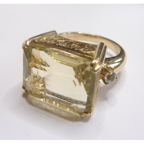 93 - A 9-carat dress ring set with a large citrine-like stone