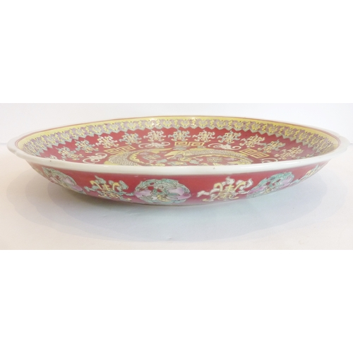 19 - A decorative Chinese dish with 'dragon fish' decoration