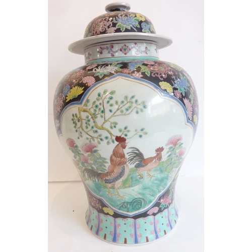 24 - A large decorative Chinese jar and cover