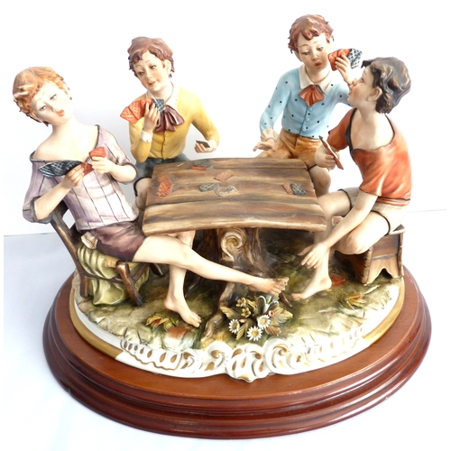 33 - 'Card players' - a large Capodimonte group on a wooden base