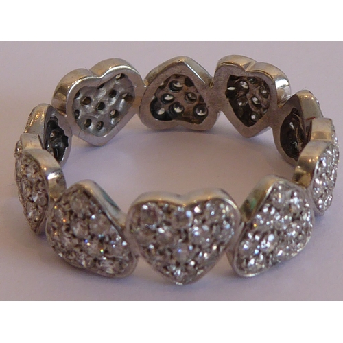 103 - A modern heavy white-metal eternity-style ring modeled as ten upright and alternating inverted heart... 