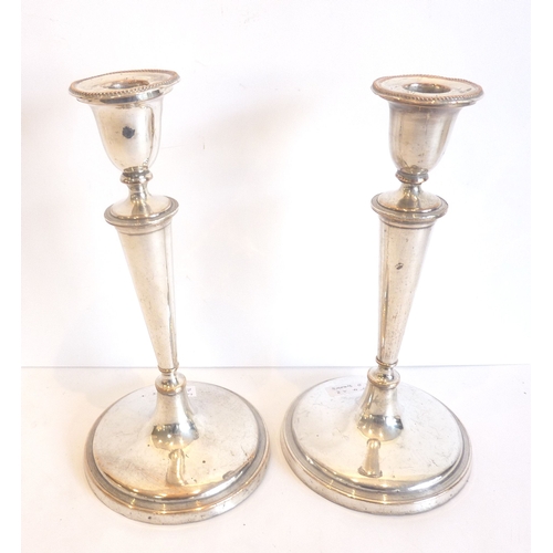 103 - A pair of late Georgian silver-plated candlesticks