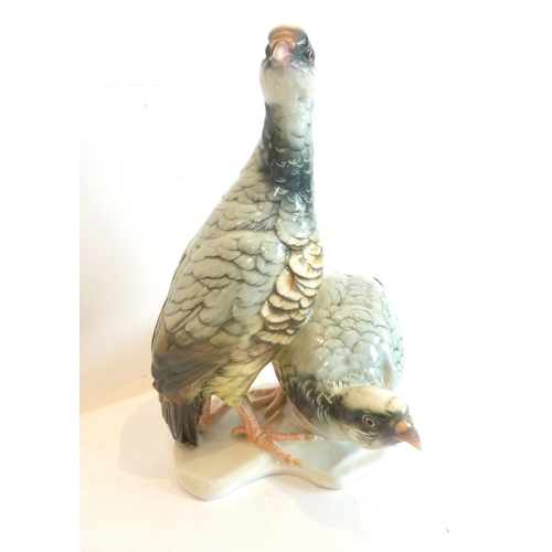 17 - A pair of hand-decorated porcelain partridges