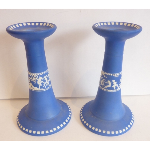 44 - A pair of Jasperware blue and white candlesticks