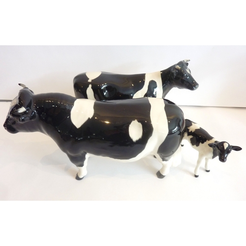 44B - A Beswick Friesian cow, calf and bull set