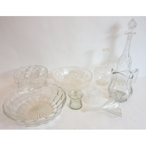 48 - A selection of glassware to include fruit bowls, a jug, a funnel and decanters