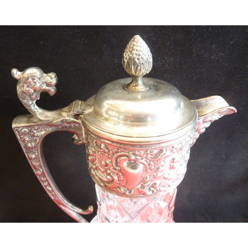 58 - A heavy crystal and silver-plate-mounted claret jug