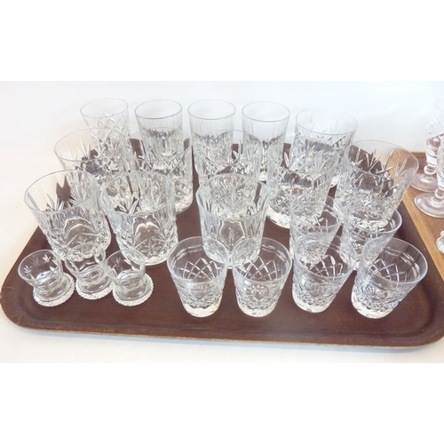 61 - A good selection of mostly hand-cut drinking glasses to include tumblers, shots and sherries