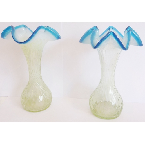 62A - A pair of 19th century Vaseline glass vases with wrythern body and blue edging