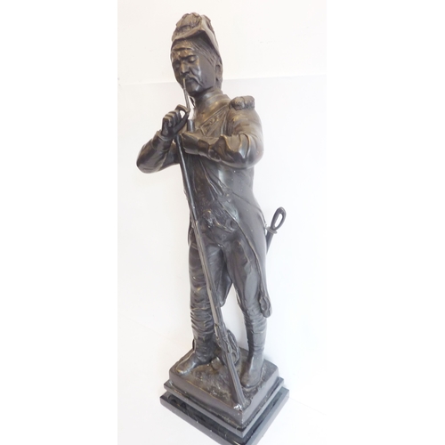 67 - A large 19th century style (reproduction) bronze model of a soldier lighting his pipe; signed to bot... 