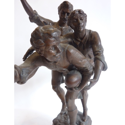 72 - An early 20th century bronzed figure, 'Foot Ball'; together with others similar