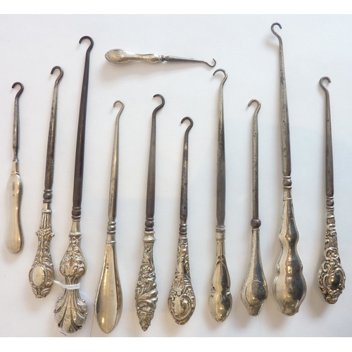 91 - A collection of eleven early silver button-hooks