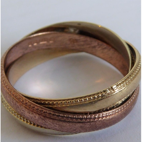 183 - A 9-carat gold Russian style wedding ring set with diamonds (The cost of UK postage via Royal Mail S... 