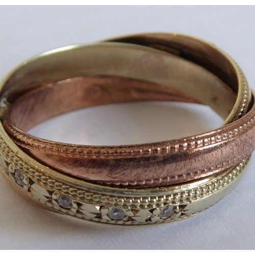 183 - A 9-carat gold Russian style wedding ring set with diamonds (The cost of UK postage via Royal Mail S... 