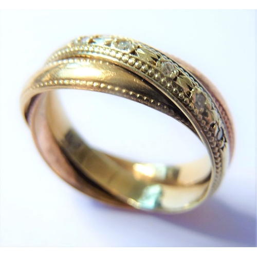 183 - A 9-carat gold Russian style wedding ring set with diamonds (The cost of UK postage via Royal Mail S... 