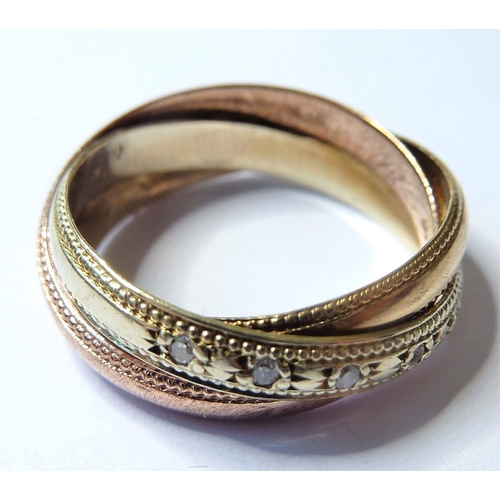 183 - A 9-carat gold Russian style wedding ring set with diamonds (The cost of UK postage via Royal Mail S... 