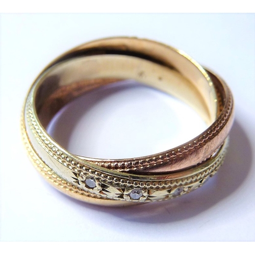 183 - A 9-carat gold Russian style wedding ring set with diamonds (The cost of UK postage via Royal Mail S... 