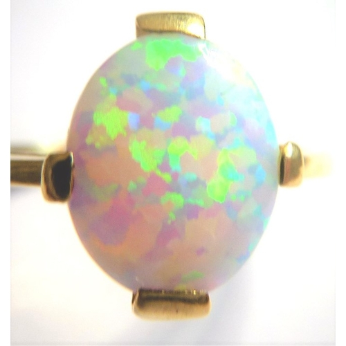 188 - A vintage 14-carat gold ring set with a large opal
 (The cost of UK postage via Royal Mail Special D... 