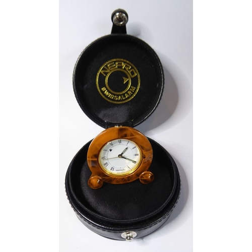 218 - A miniature Missiaglia travel alarm clock; faux-tortoiseshell enamel case surrounding a white-enamel... 