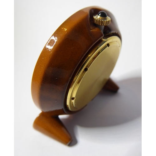 218 - A miniature Missiaglia travel alarm clock; faux-tortoiseshell enamel case surrounding a white-enamel... 
