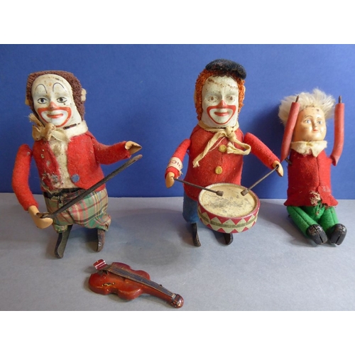 227 - Two clockwork musicians by Schuco (Germany) to include a fiddle player and a drummer, together with ... 
