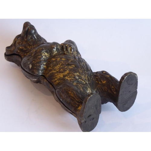 104 - A late 19th century money bank in the form of a standing cast iron bear (traces of original gilding)... 