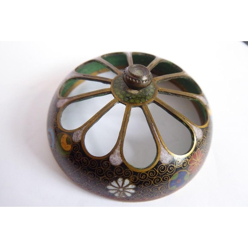 114 - A Japanese Meiji period two-handled cloisonné koro; the pierced dome topped cover flanked by two ang... 