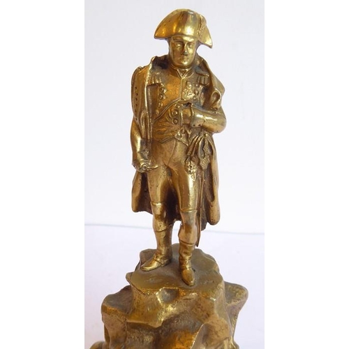 118 - A heavy gilt-bronze model of Napoleon standing upon elevated jagged rockwork, probably late 19th/ear... 