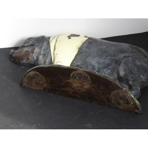 120 - An early 20th century hand painted cast iron doorstop modelled as a pig (20cm)