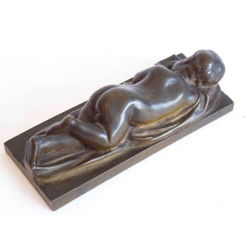 131 - A 19th century continental bronze model of a naked infant asleep upon a robe; good patination and th... 