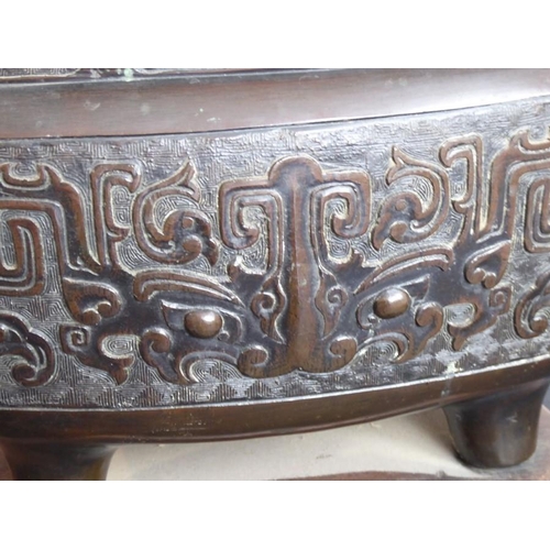 132 - A large mid 19th century patinated Japanese bronze table two-handled temple censer; Xuande mark belo... 