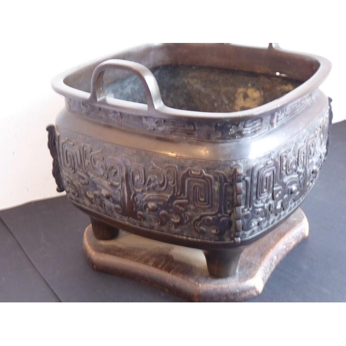 132 - A large mid 19th century patinated Japanese bronze table two-handled temple censer; Xuande mark belo... 