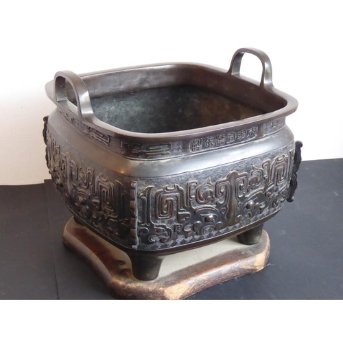 132 - A large mid 19th century patinated Japanese bronze table two-handled temple censer; Xuande mark belo... 