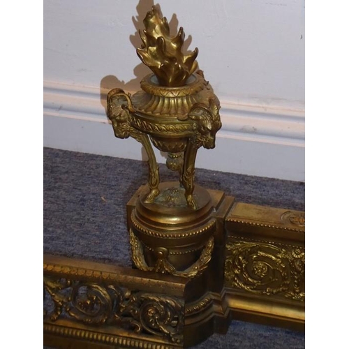 136 - A large 19th century gilt-metal French Louis XVI-style chenet; the two neo-classical-style urns with... 