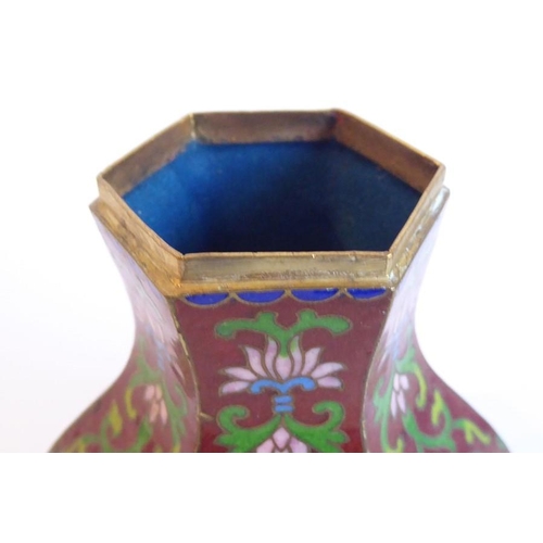 138 - A late 19th century Oriental (probably Chinese) cloisonné vase and cover of squared hexagonal balust... 