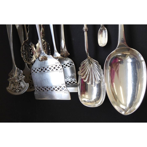 193 - An interesting and ornate selection of late 19th century silver-plated serving tongs, salad servers,... 