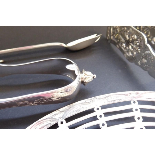 193 - An interesting and ornate selection of late 19th century silver-plated serving tongs, salad servers,... 