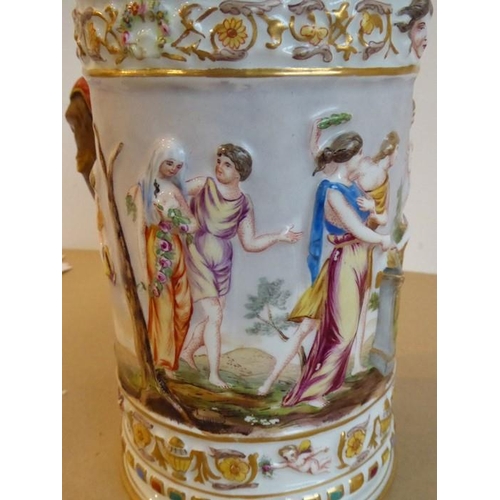 20 - A unusual and large 19th century Capodimonte porcelain tankard and cover; the cover finial as a wing... 