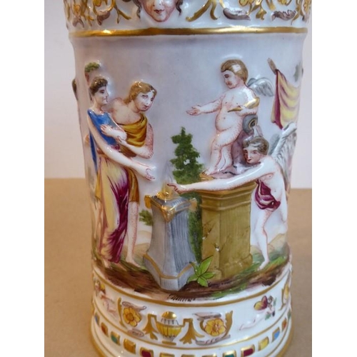 20 - A unusual and large 19th century Capodimonte porcelain tankard and cover; the cover finial as a wing... 