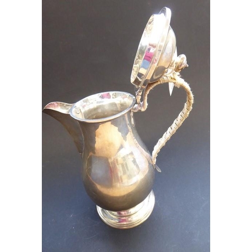 202 - A heavy hallmarked silver baluster-shaped hot-water jug with hinged lid, maker's mark 'S & Co', assa... 