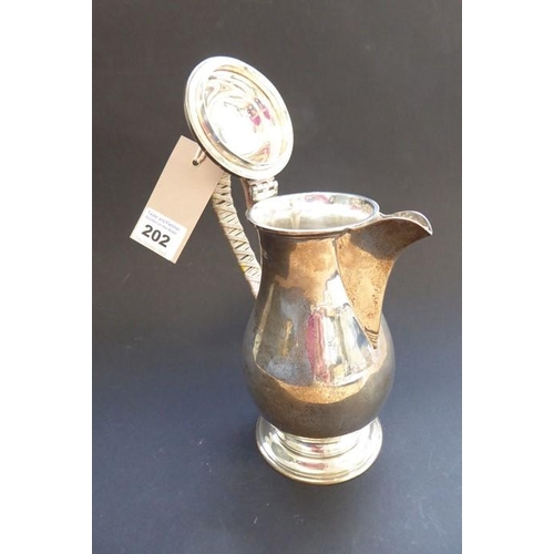 202 - A heavy hallmarked silver baluster-shaped hot-water jug with hinged lid, maker's mark 'S & Co', assa... 