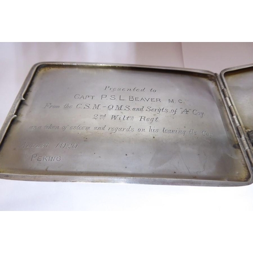 217 - A silver cigarette case and silver ashtray; father and son pieces with regimental inscriptions: 'Pre... 