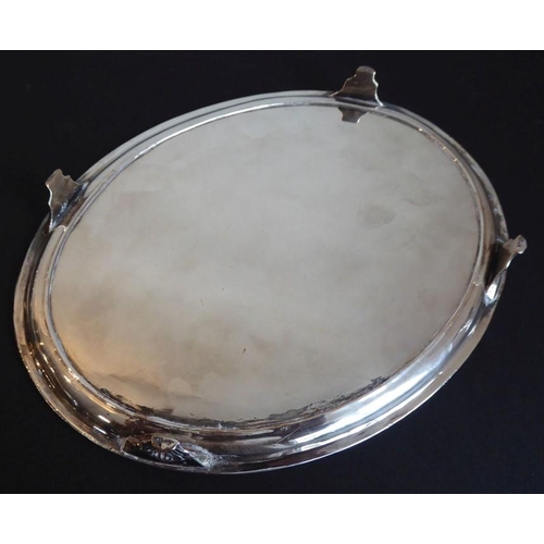 223 - A Georgian-style oval silver plated platter (armorial rubbed), raised reeded edge top above four she... 