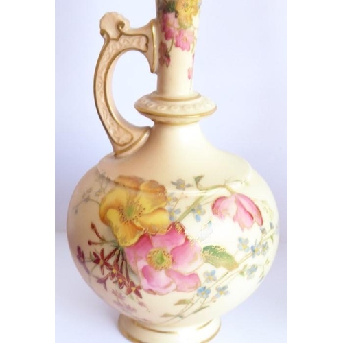 24 - An opposing pair of early 20th century Royal Worcester blush porcelain ewers; each delicately hand d... 