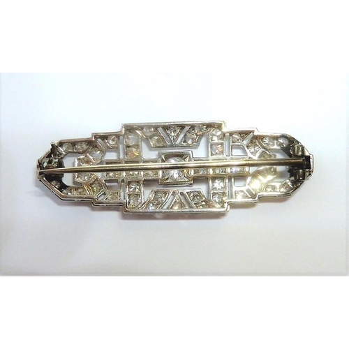 242 - An Art Deco diamond-set brooch of shaped rectangular openwork geometric design, set throughout with ... 