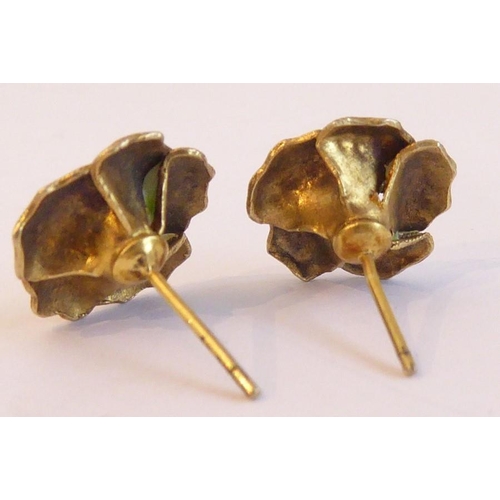 246 - A pair of lady's stud earrings; yellow metal and enamel modelled as flower heads in Danish style