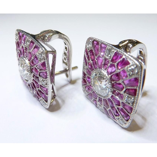 248 - A pair of ruby and diamond cluster earrings (The cost of UK postage via Royal Mail Special Delivery ... 