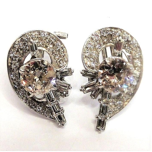 258 - A pair of diamond cluster earrings, the centre stones 1 carat each surrounded by baguette and brilli... 