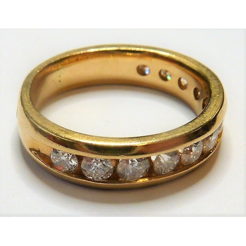 266 - A 14-carat gold half eternity ring set with twelve fine white diamonds; ring size  (The cost of UK p... 